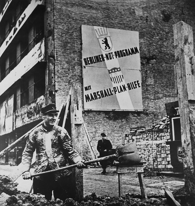 Rebuilding in Germany, circa 1948. The sign on the wall says “Berlin Emergency Program, with Marshall Plan help.”