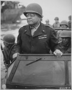 Benjamin Davis in uniform standing up in an automobile.