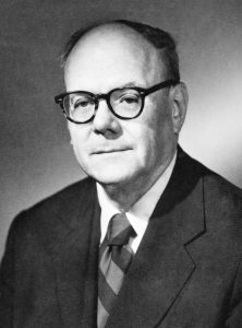 Image of Forrest Pogue in suit and tie