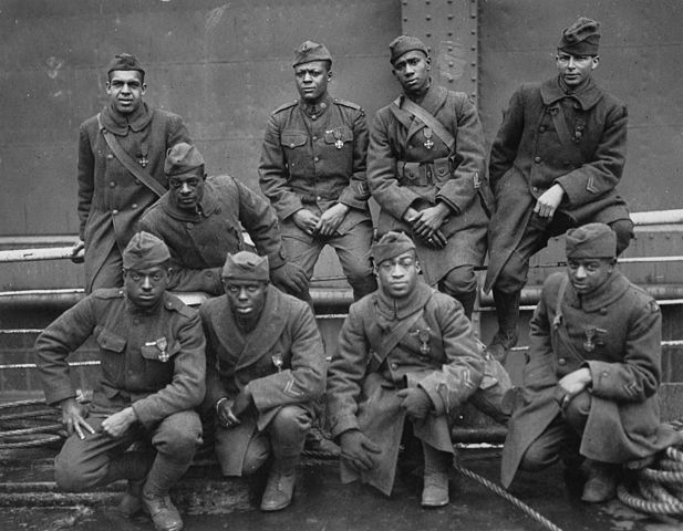 Group of Black Soldiers in World War I era uniforms wearing medals