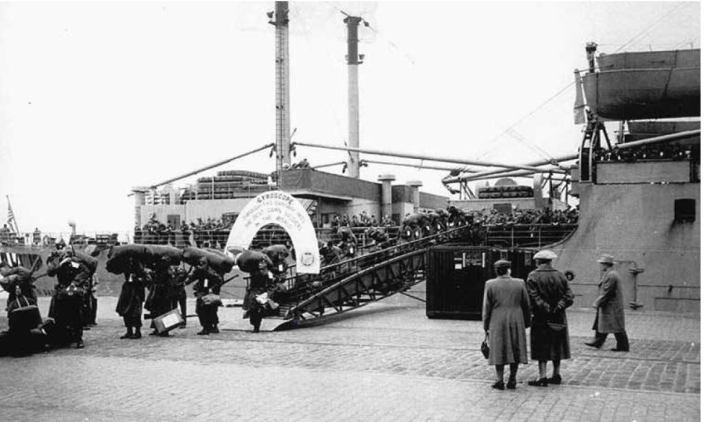 Soldiers disembarking from a ship in a German port