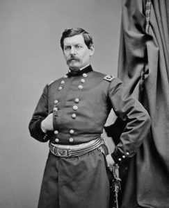 Portrait of George McClellan in uniform in front of a curtain