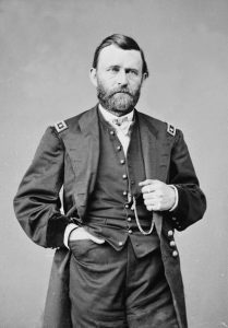 Ulysses Grant in uniform with right hand in pocked and left hand on his jacket lapel