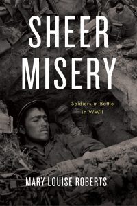 Sheer Misery book cover featuring a Soldier lying in a foxhole with another Soldier's booted feet next to his head.