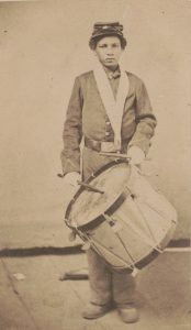 Black male child in Civil War uniform with drum