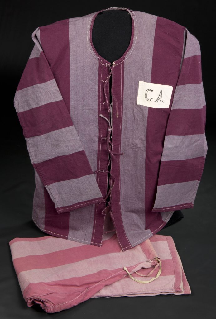 Cotton shirt and pants with alternating magenta and mauve vertical stripes. The letters "CA" are printed in black on a white swatch on the left breast.