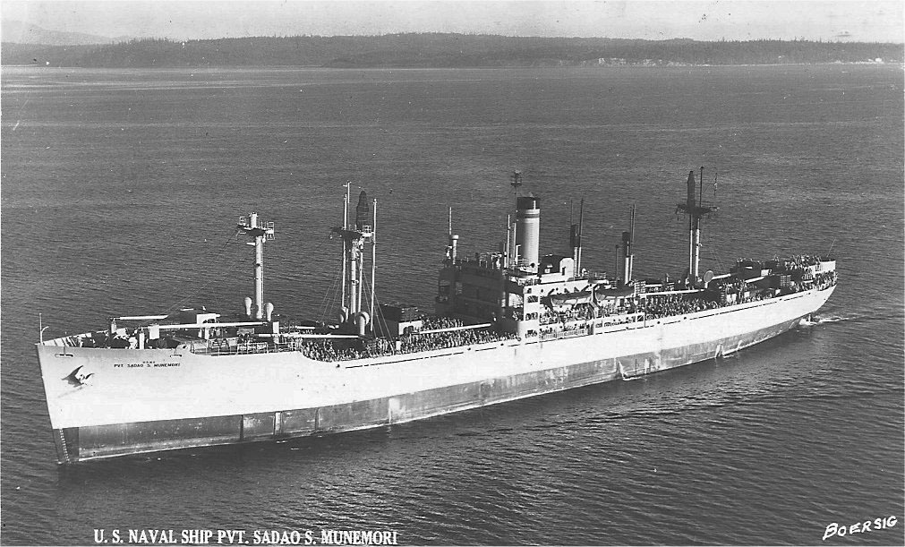 U.S. Naval Ship Pvt. Sadao S. Munemori at sea showing passengers on the deck. Photographed from the air. 