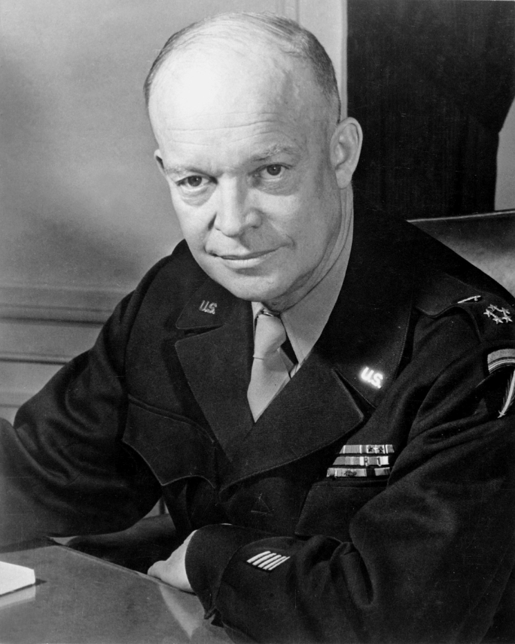 Eisenhower seated behind a desk wearing a World War II era Army uniform