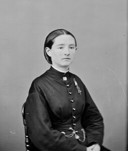 Mary Walker seated, facing right, looking at the camera.