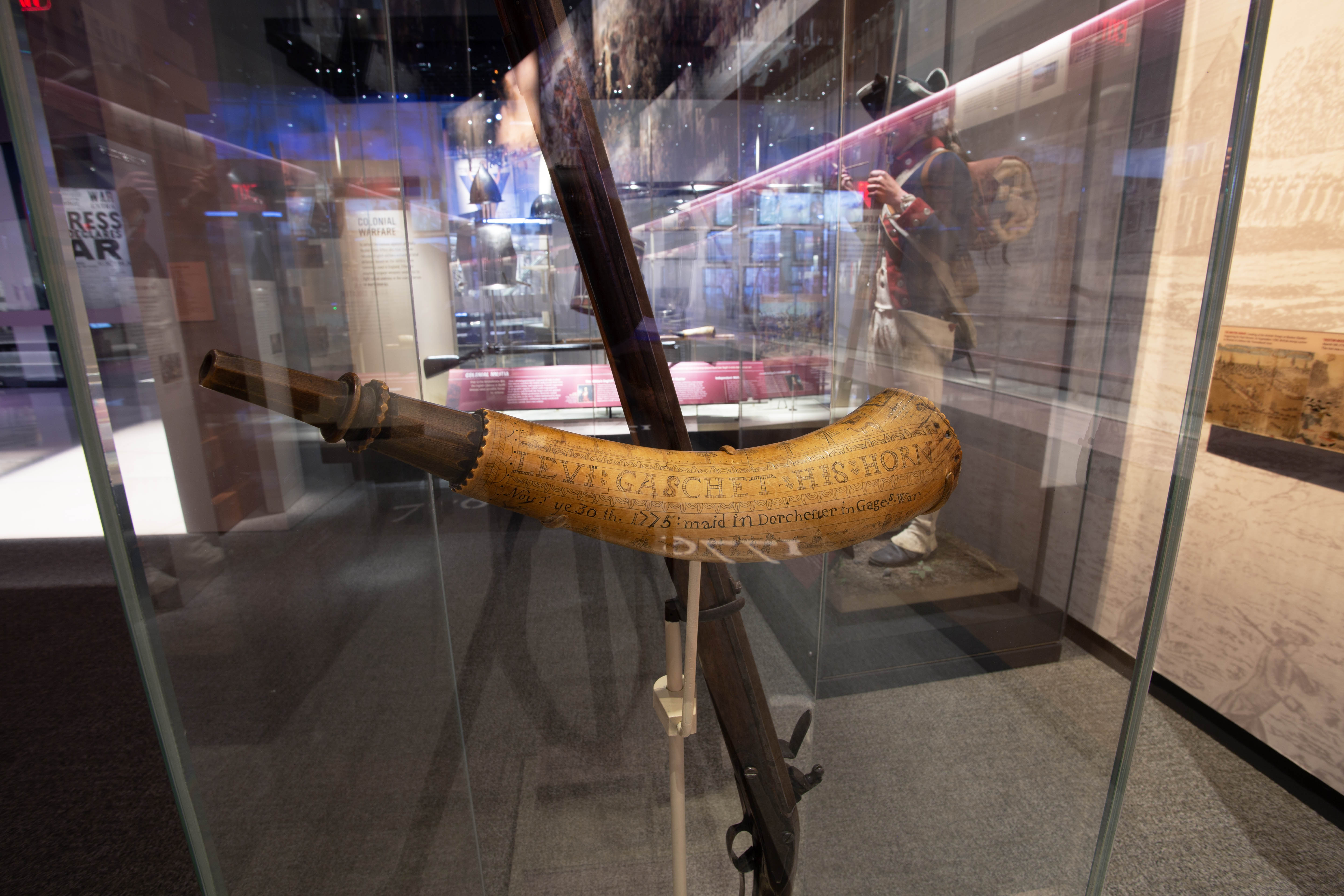This powder horn, made from a cow’s horn with a wood plug at the larger end, belonged to Sgt. Levi Gaschet during the Revolutionary War. Sergeant Gaschet enrolled in the Northborough Minutemen in 1775 and served at the Siege of Boston. The engraving on the horn commemorates his service on Dorchester Heights during the siege. American militia often provided their own equipment. Many of them carried a personal powder horn to keep gunpowder dry and to facilitate loading their muskets or rifles.