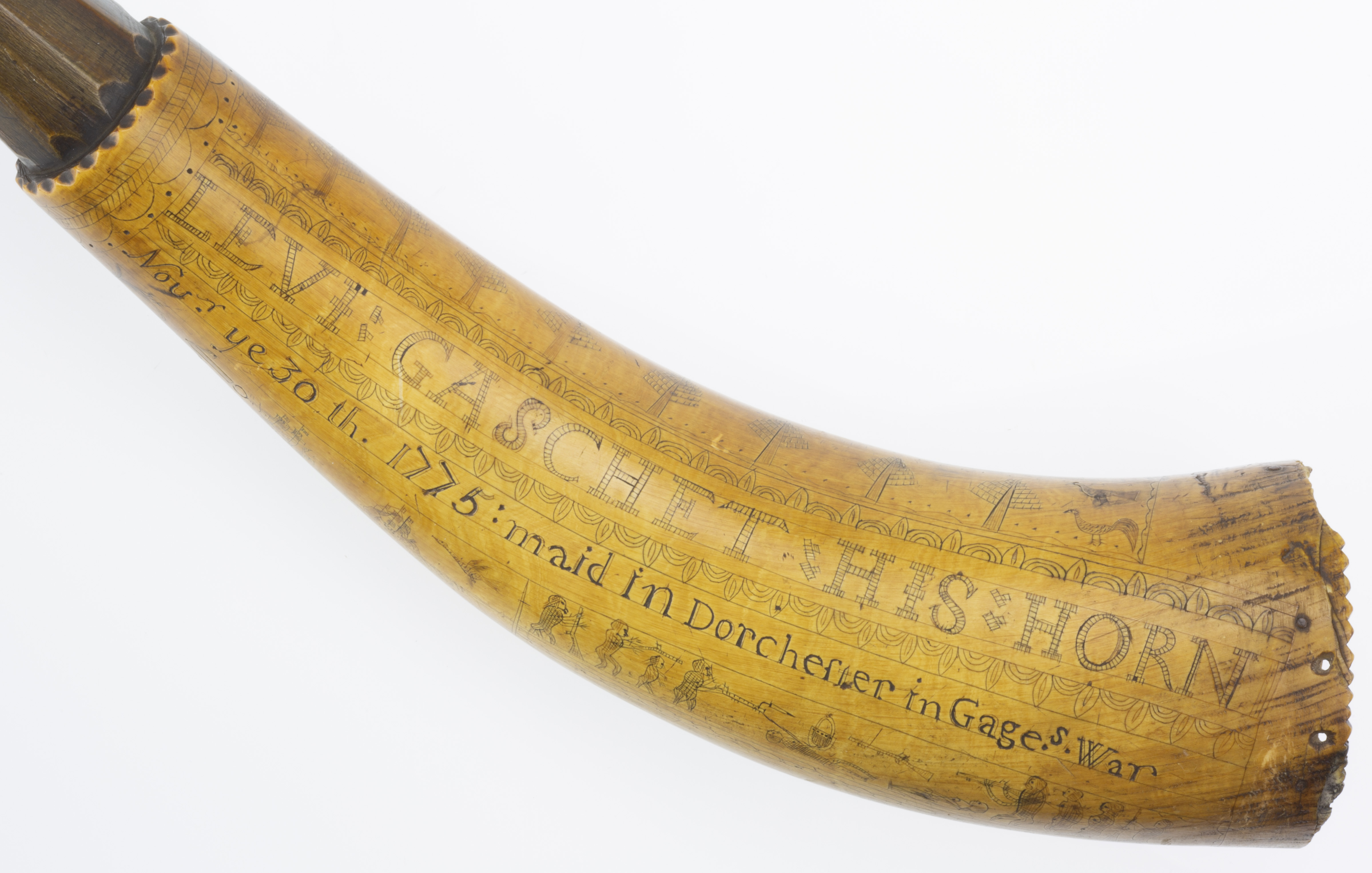 This powder horn, made from a cow’s horn with a wood plug at the larger end, belonged to Sgt. Levi Gaschet during the Revolutionary War. Sergeant Gaschet enrolled in the Northborough Minutemen in 1775 and served at the Siege of Boston. The engraving on the horn commemorates his service on Dorchester Heights during the siege. American militia often provided their own equipment. Many of them carried a personal powder horn to keep gunpowder dry and to facilitate loading their muskets or rifles.
