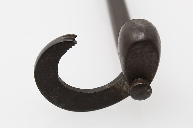 Iron tooth extractor with a wooden handle, also known as a dental key. Object ID MC390. Courtesy of The Fort Ticonderoga Museum Collection.