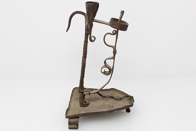Iron lamp designed to hold a single candle. Object ID FT-60.129. Courtesy of The Fort Ticonderoga Museum Collection.
