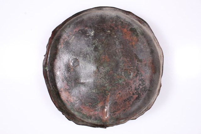 One copper alloy pot lid with lift ring and stamped makers mark. Found during the restoration of Fort Ticonderoga in the early 20th century. Object ID 2020.2.3. Courtesy of The Fort Ticonderoga Museum Collection.