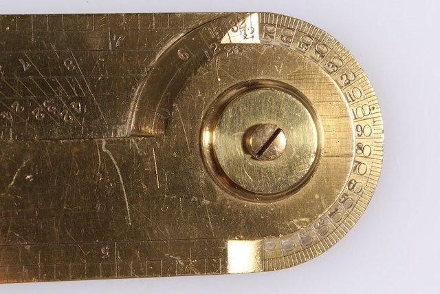 Brass artillery calipers. The calipers are engraved with scales for measuring bore diameters and shot diameters, which allowed a soldier to quickly gauge the caliber of a cannonball or cannon without having to measure or weigh it. Object ID 2022.2.398. Courtesy of The Fort Ticonderoga Association.