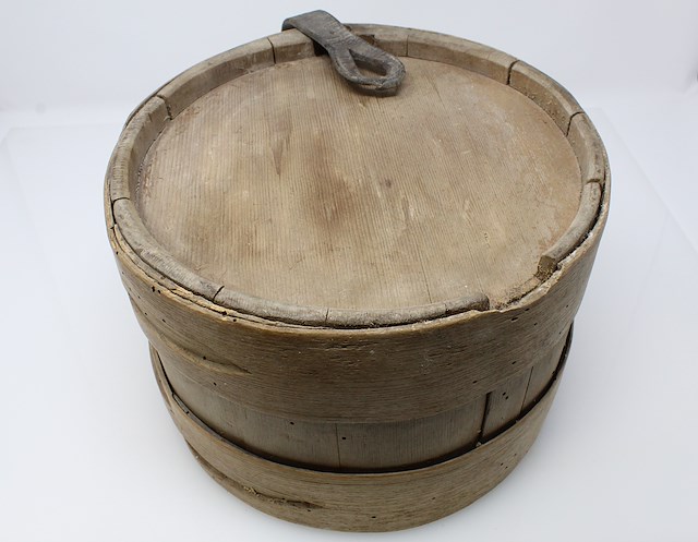 Wooden canteen consisting of 12 staves held together by two wooden bands. Object ID 2019.FIC.114. Courtesy of The Fort Ticonderoga Museum Collection.