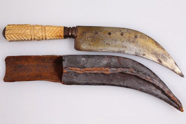 Curved knife with bone handle and leather sheath. Object ID 2015.2.1-2. Courtesy of The Fort Ticonderoga Museum Collection.