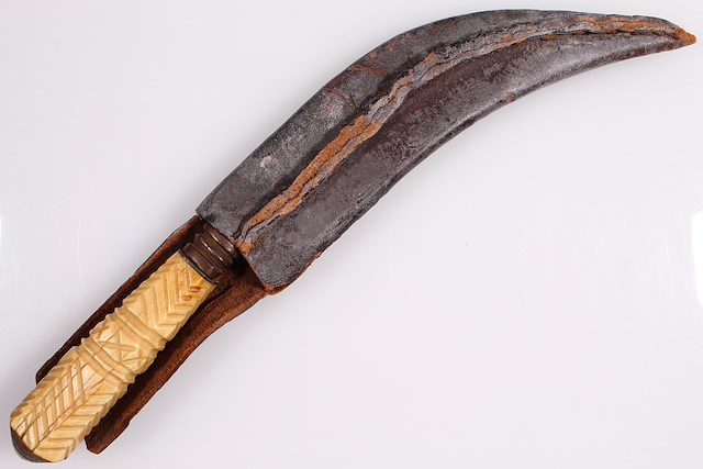Curved knife with bone handle and leather sheath. Object ID 2015.2.1-2. Courtesy of The Fort Ticonderoga Museum Collection.