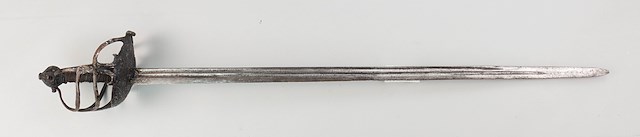 English basket-hilt “Mortuary” backsword with a straight single edged, double fuller 31.25″ blade. Object ID 2009.0098.043. Courtesy of the Fort Ticonderoga Museum Collection.