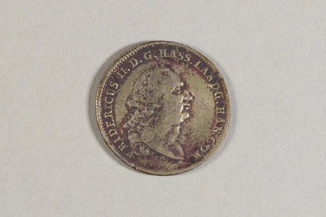 Silver one thaler coin from Hesse-Kassel, a state in the Holy Roman Empire. Object ID 2004.0037.002. Courtesy of the Fort Ticonderoga Museum Collection.