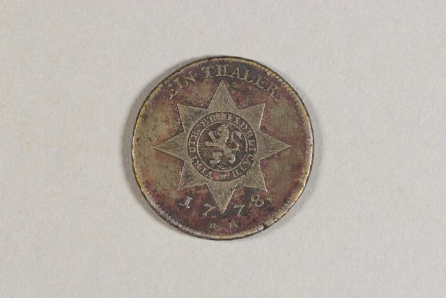 Silver one thaler coin from Hesse-Kassel, a state in the Holy Roman Empire. Object ID 2004.0037.002. Courtesy of the Fort Ticonderoga Museum Collection.