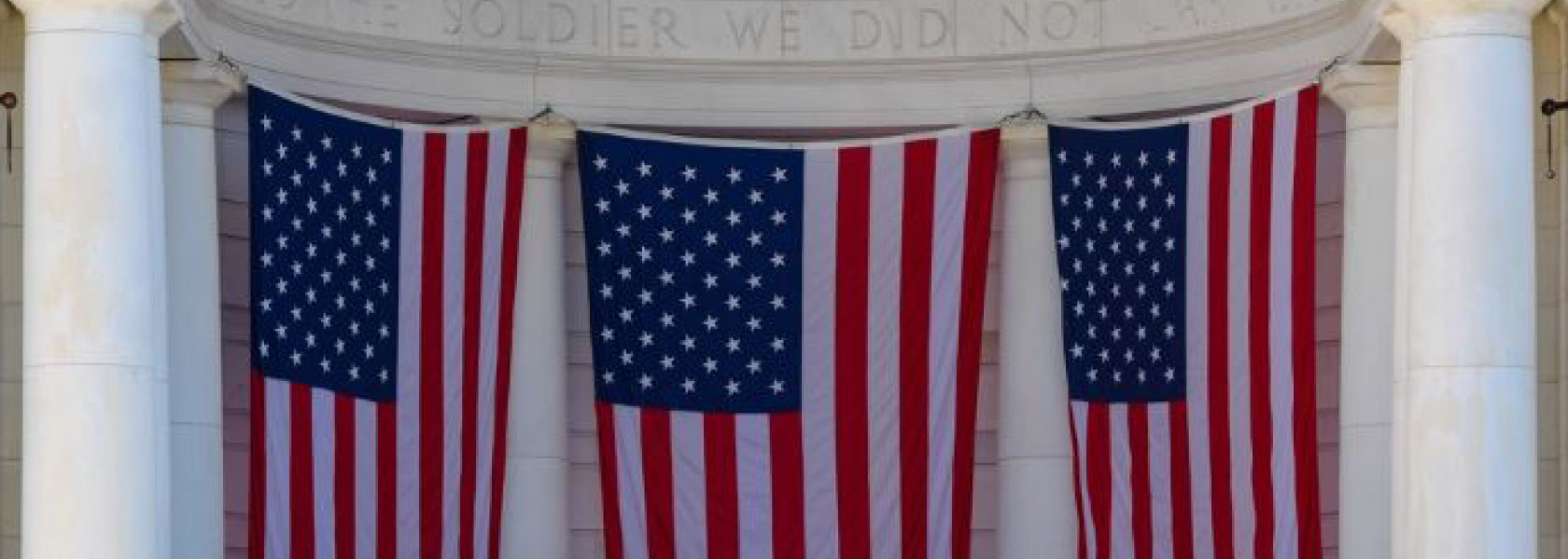 3 American Flags draped down